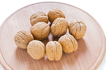 Walnuts on rustic  wooden table