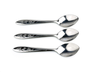 Silver spoon on white background