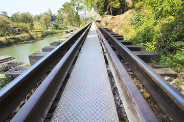 perspective of old wood bridge railways in kanchanaburi thailand