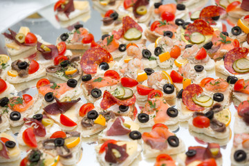 Different types of canapes on buffet table