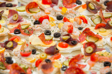 Different types of canapes on buffet table