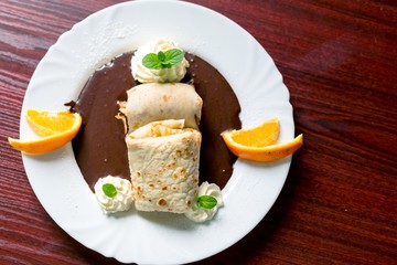 Delicious pancakes with chocolate sauce