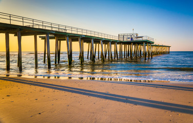 Fishing pier and the Atlantic Ocean at sunrise in Ventnor City,