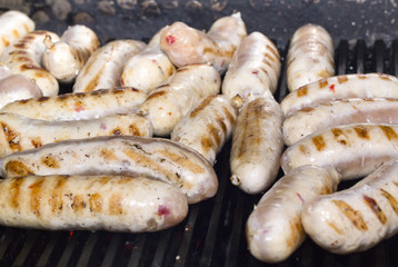 cooking sausages on the grill in the restaurant