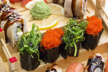 Japanese sushi, vegetables and seafood in the restaurant