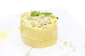 salad with cheese and crab meat decorated with nuts and mint