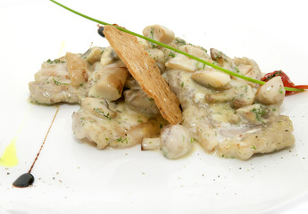 baked meat with mushrooms and cream sauce