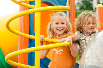 Two happy children on the playground