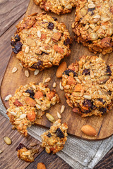 Fototapeta premium Homemade oatmeal cookies with seeds and raisin