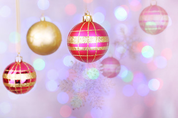 Christmas decorations hanging on festive background