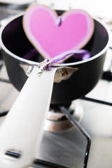 heart and key in a saucepan on the hob