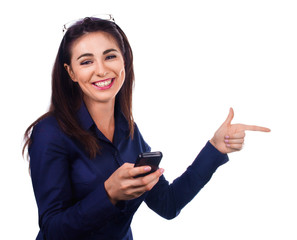 Business woman is pointing a side on white