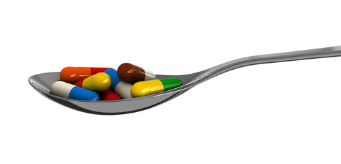 Pills in spoon