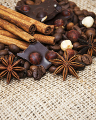Coffee beans with cinnamon sticks and chocolate
