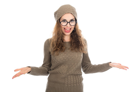 Surprised girl in glasses with arms spread apart.