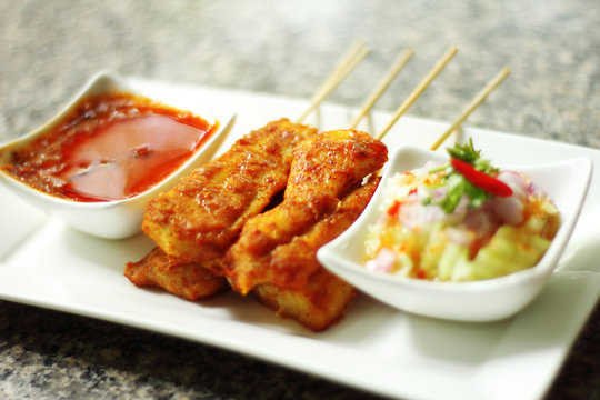 Close Up Yellow Indian Fish Satay In Dish