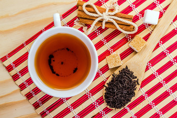 romantic mug of tea on striped napkin
