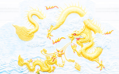 Obraz premium golden dragon on the wall of temple,thailand