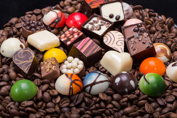 Set of a various chocolate pralines and coffee beans