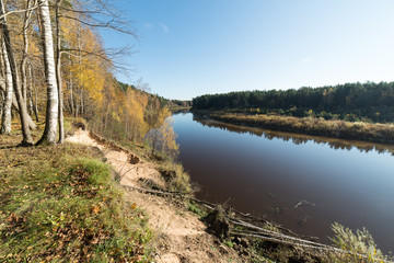 Fototapeta na wymiar scenic autumn colored river in country