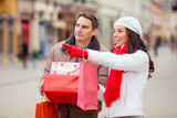 Young couple looking for Christmas presents