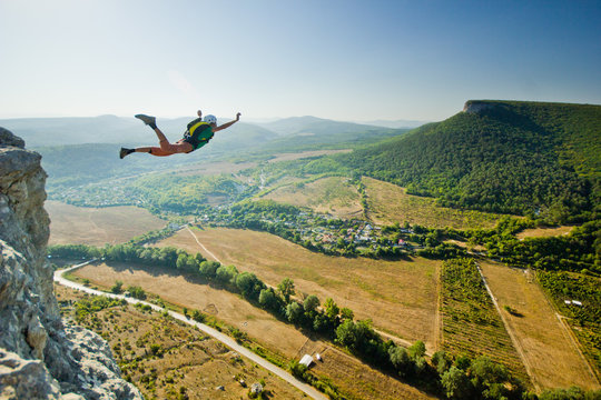 base-jumper jumps from the cliff