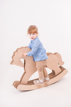 Child with the toy horse