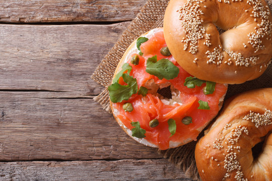 Traditional bagel with salmon and cheese top view horizontal