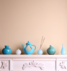 Fireplace with beautiful blue decorations in room