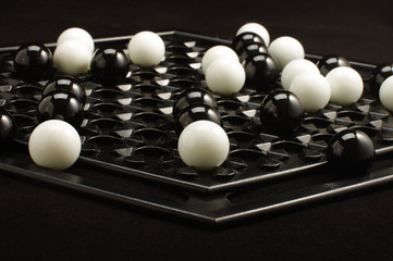 Abalone game marble balls on the game board isolated