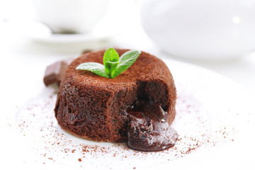 Hot chocolate pudding with fondant centre on plate, close-up