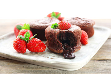 Hot chocolate pudding with fondant centre with strawberries,