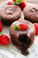 Hot chocolate pudding with fondant centre with strawberries,
