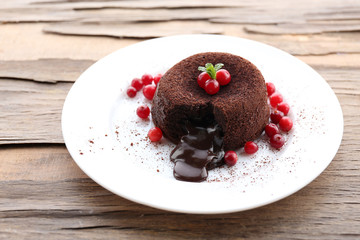 Hot chocolate pudding with fondant centre on plate, close-up