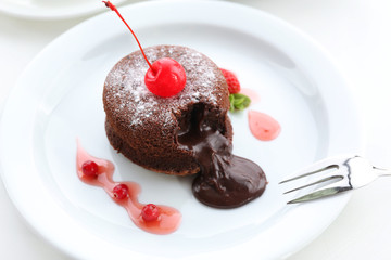 Hot chocolate pudding with fondant centre on plate, close-up