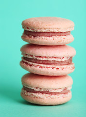Gentle colorful macaroons on color background