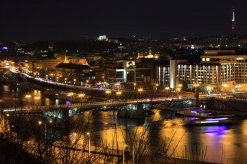 Fototapeta na wymiar Winter night Prague City above River Vltava, Czech Republic