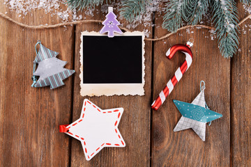Blank photo frames and Christmas decor with snow fir tree