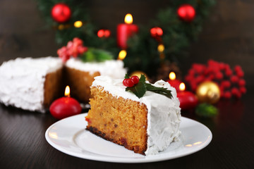 Slice of cake covered cream with Christmas decoration