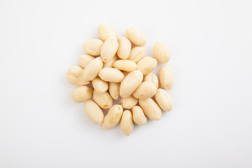 Peeled peanuts on white background