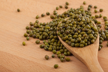 Mung beans with wooden spoon