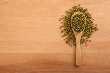 Mung beans with wooden spoon