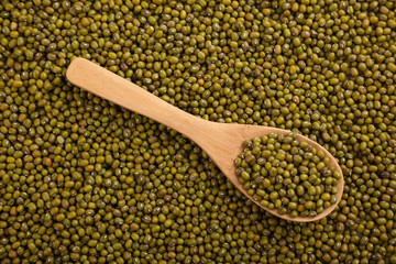 Mung beans with wooden spoon
