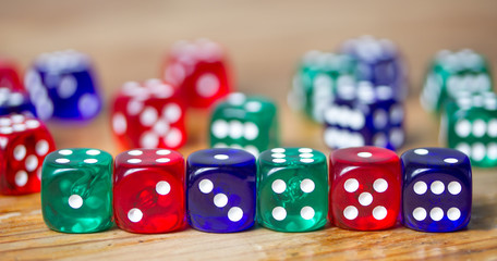 colorful dices background on wood