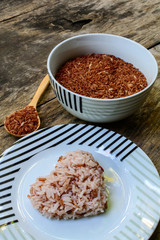 Brown rice on wooden table