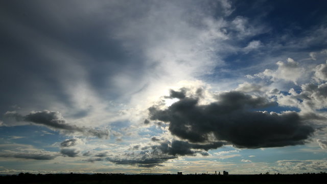 time lapse of sun light amd sky, clouds billowing.