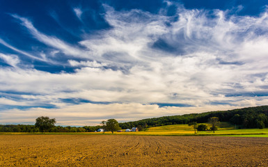 Clouds over farm fields and distant hills in rural York County,