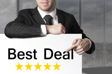 businessman pointing on sign best deal
