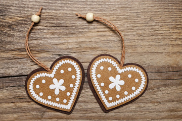 Two hearts on wooden background