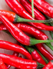 Fotobehang Spicy Chillies Means Red Pepper And Capsaicin © Stuart Miles